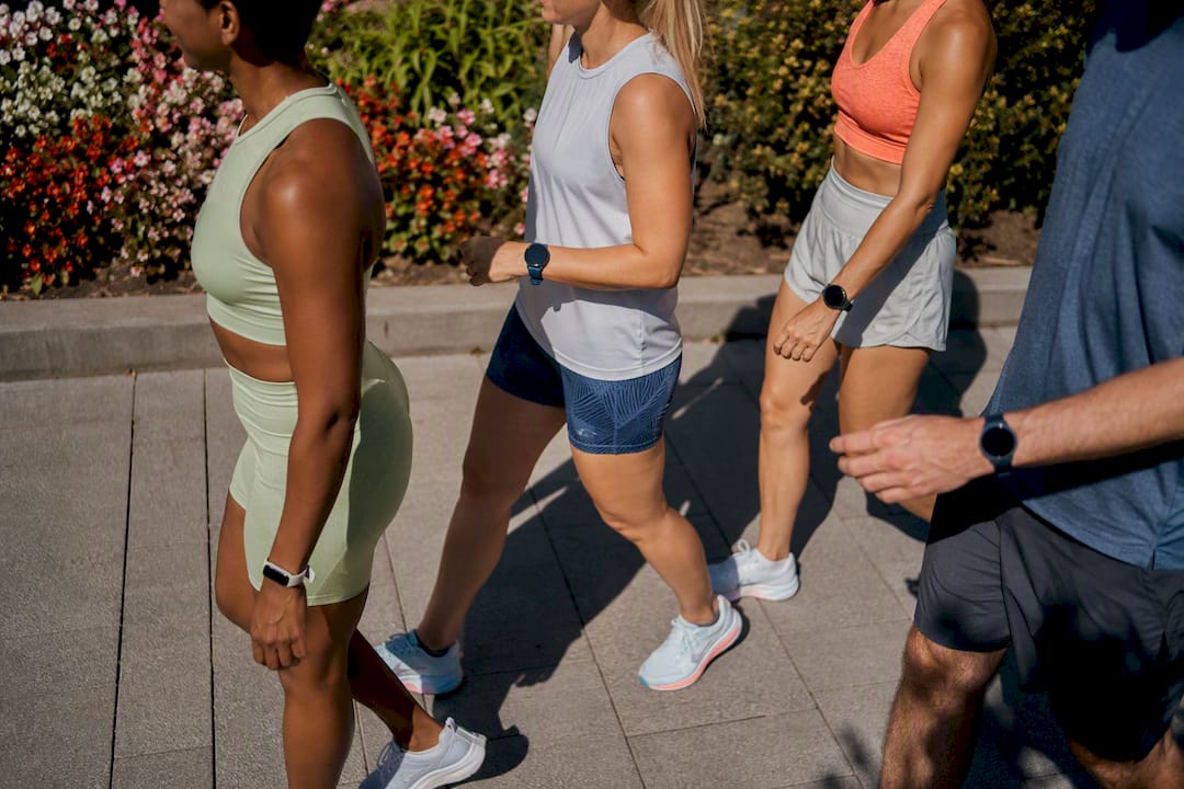Feet and legs of active commuters walking outdoors